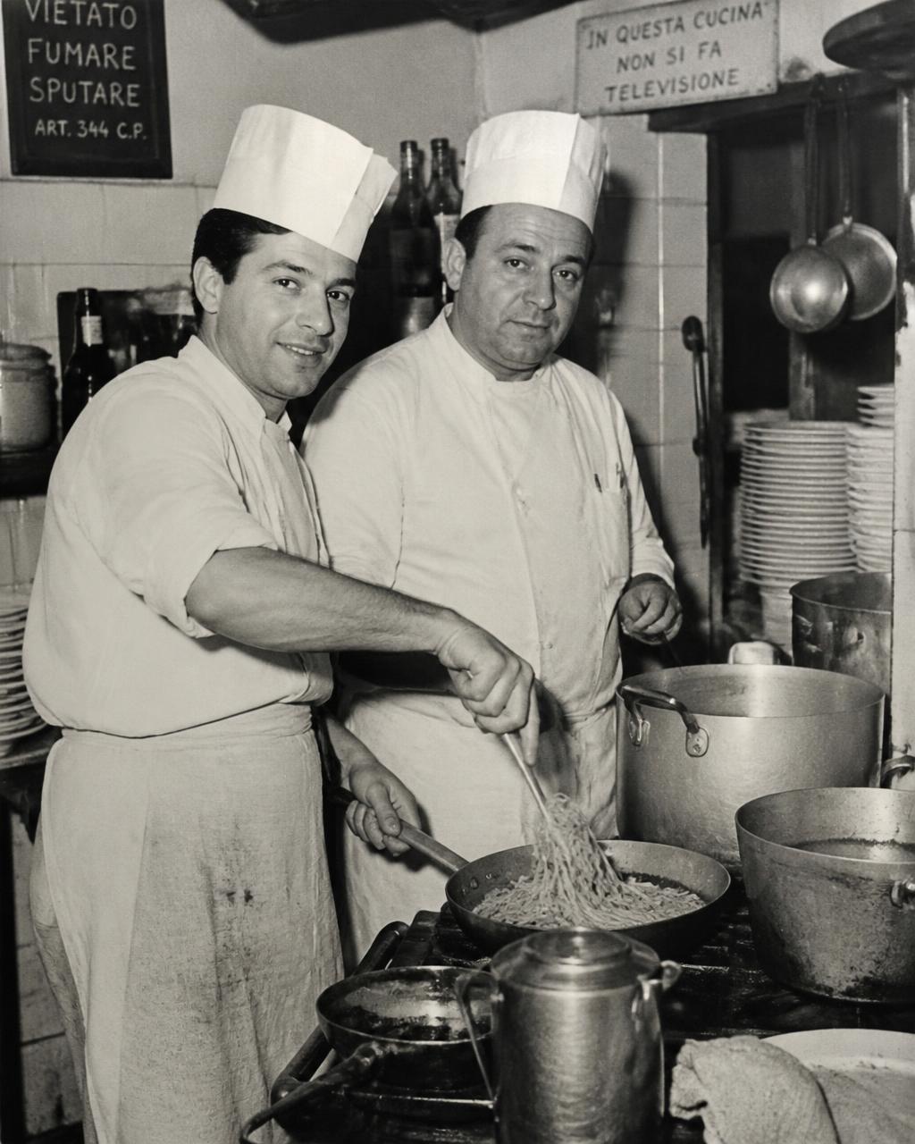 Vintage photograph of two chefs cooking together in Mario's kitchen in the 1960s